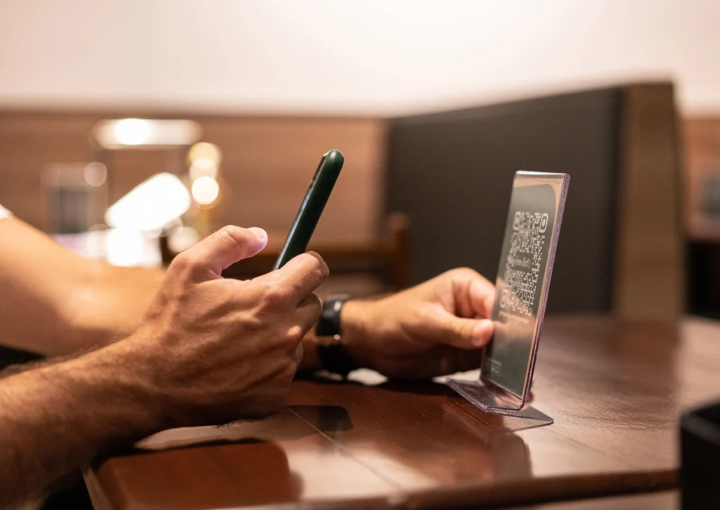 Customer scanning QR code to order food.