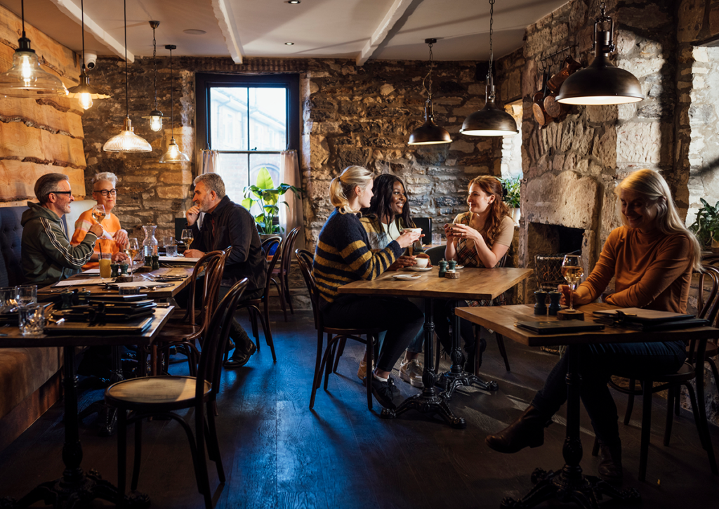 Customers dining at restaurant.