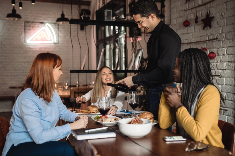 Waiter taking customer orders.